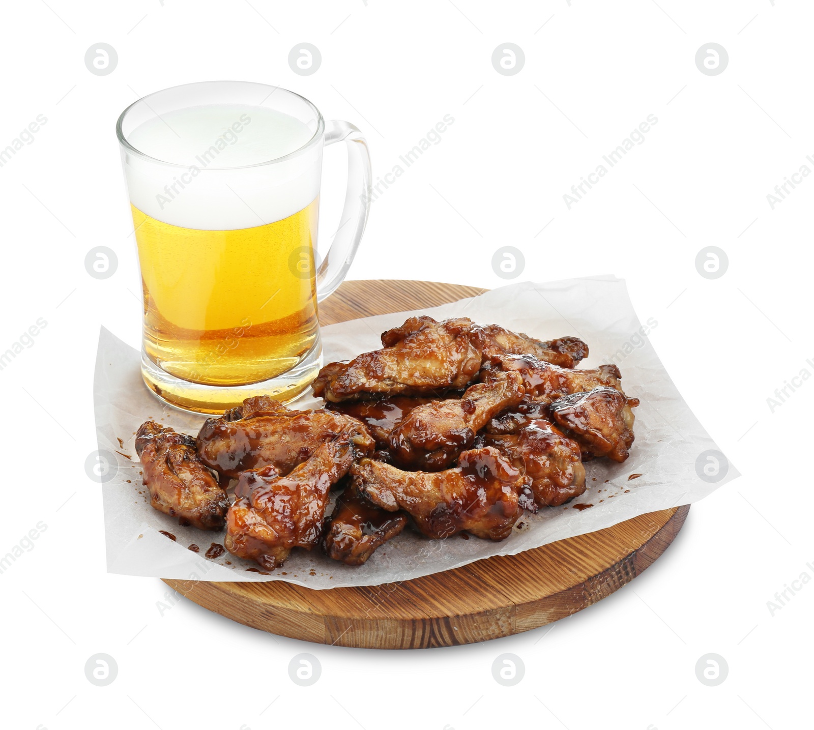 Photo of Tasty chicken wings and mug of beer isolated on white. Delicious snack