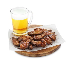 Tasty chicken wings and mug of beer isolated on white. Delicious snack
