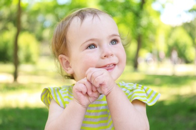Portrait of cute baby girl in park on sunny day
