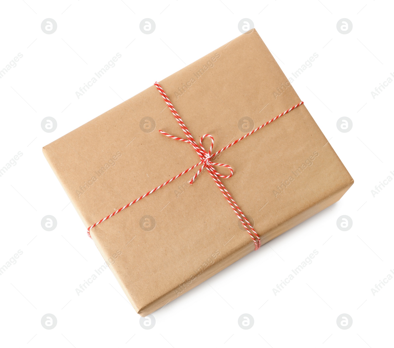 Photo of Gift box wrapped in kraft paper with bow isolated on white