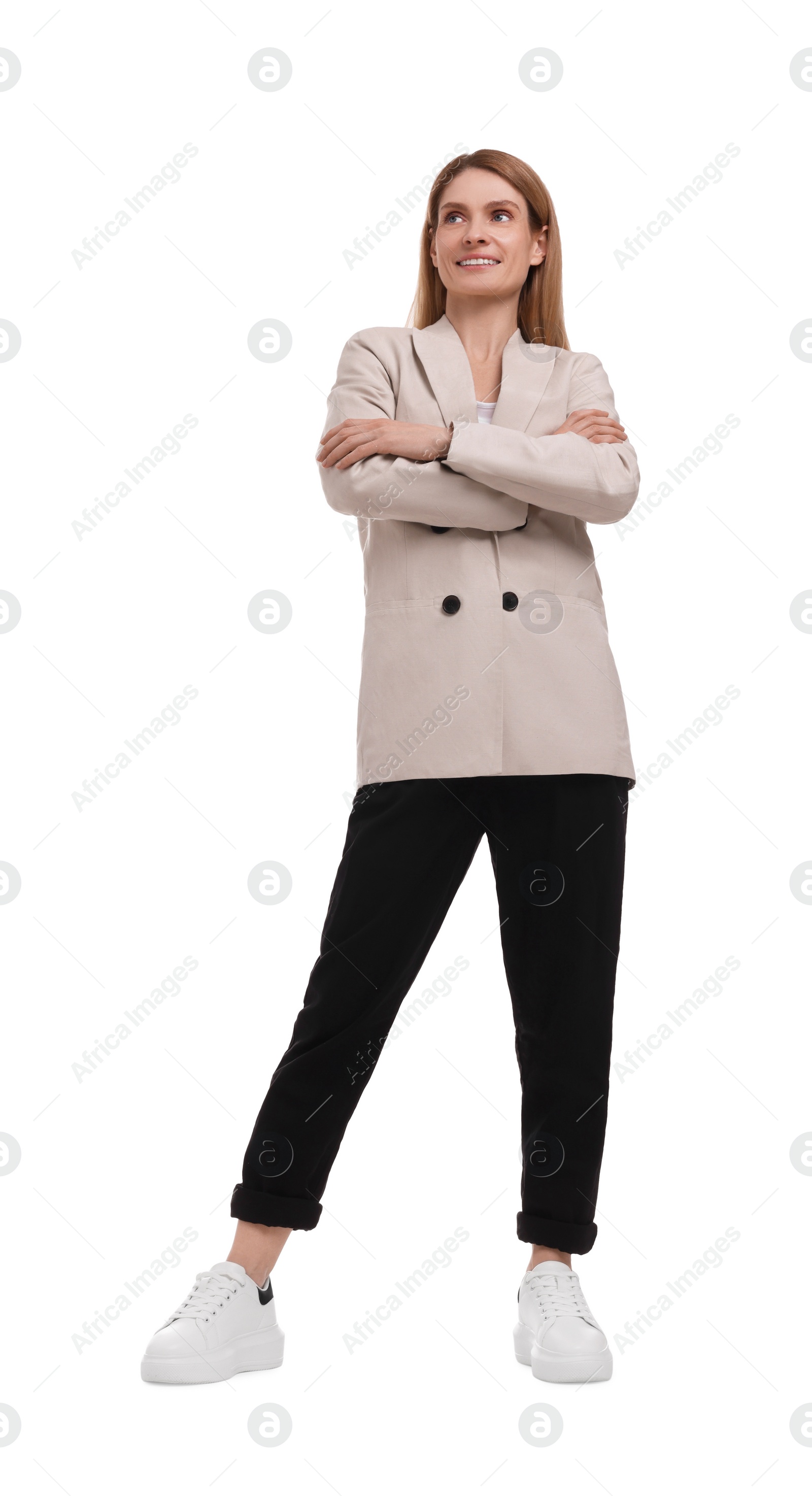 Photo of Beautiful happy businesswoman crossing arms on white background