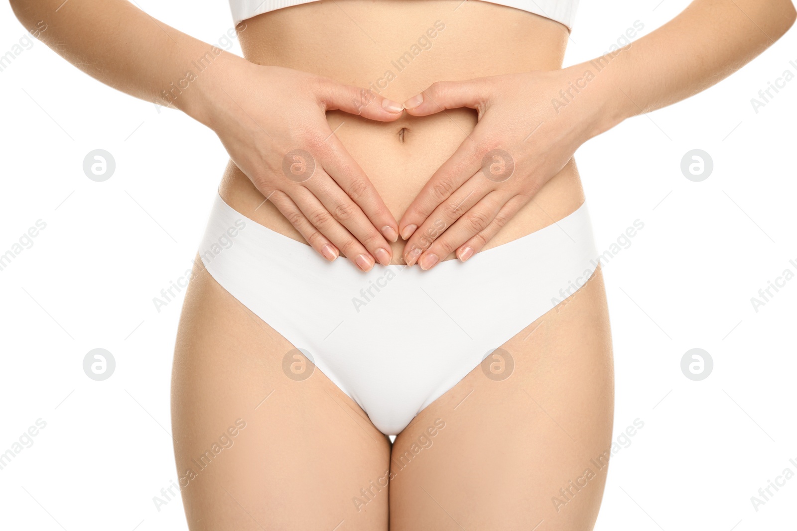 Photo of Gynecology. Woman in underwear making heart with her hands on white background, closeup