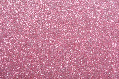 Image of Beautiful shiny pink glitter as background, closeup