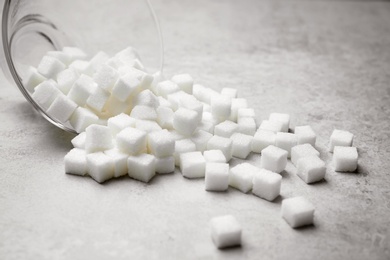 Refined sugar cubes on grey background