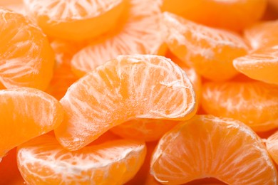 Photo of Fresh juicy tangerine segments as background, closeup