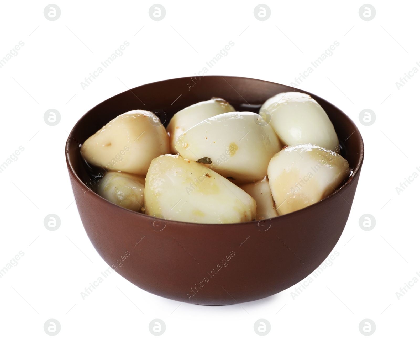 Photo of Bowl with preserved garlic on white background