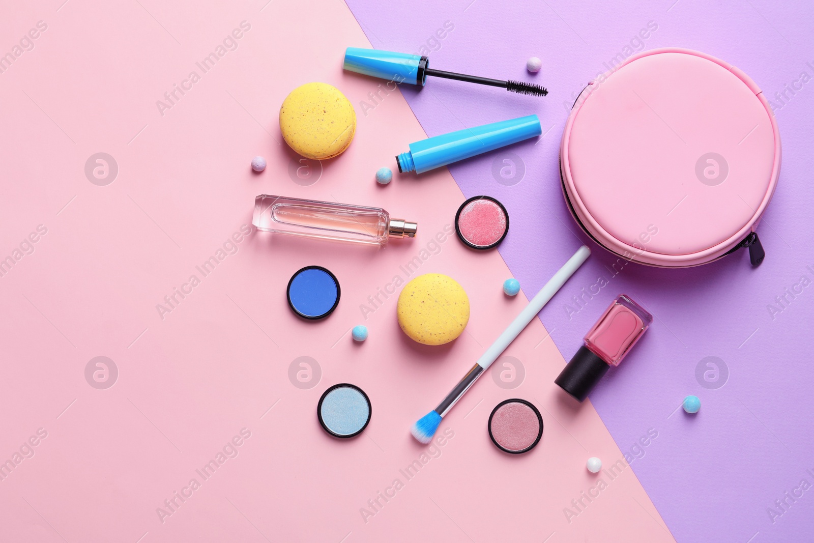 Photo of Makeup products with cosmetic bag on color background