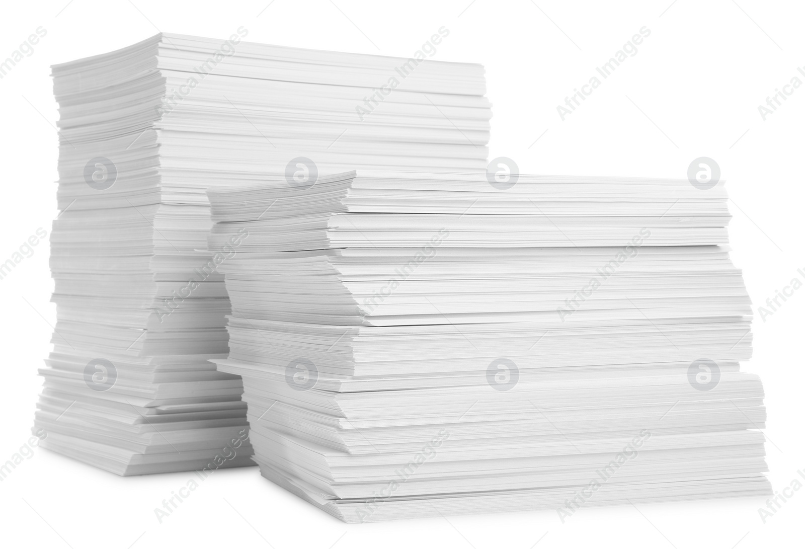 Photo of Stacks of paper sheets isolated on white