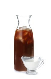 Photo of Bottle with cold brew coffee and cream on white background