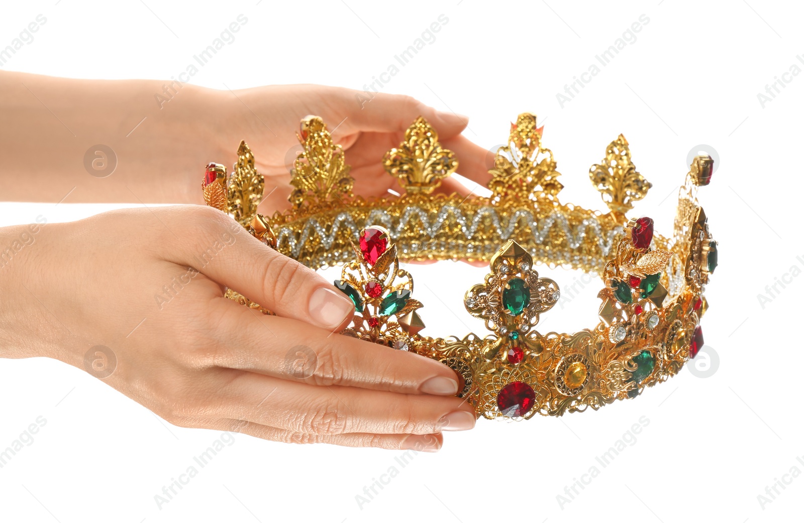 Photo of Woman holding beautiful golden crown on white background, closeup. Fantasy item