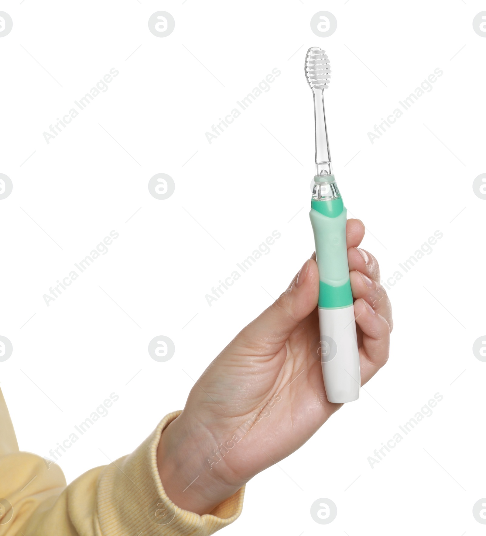 Photo of Woman holding electric toothbrush on white background, closeup