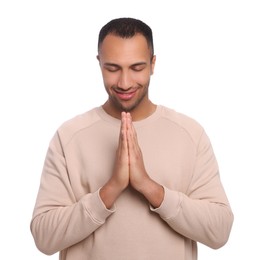 Photo of African American man with clasped hands praying to God on white background