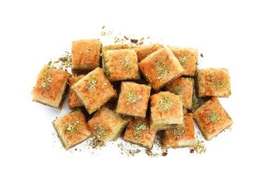 Photo of Delicious fresh baklava with chopped nuts isolated on white, top view. Eastern sweets