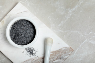 Photo of Flat lay composition with poppy seeds and space for text on marble background