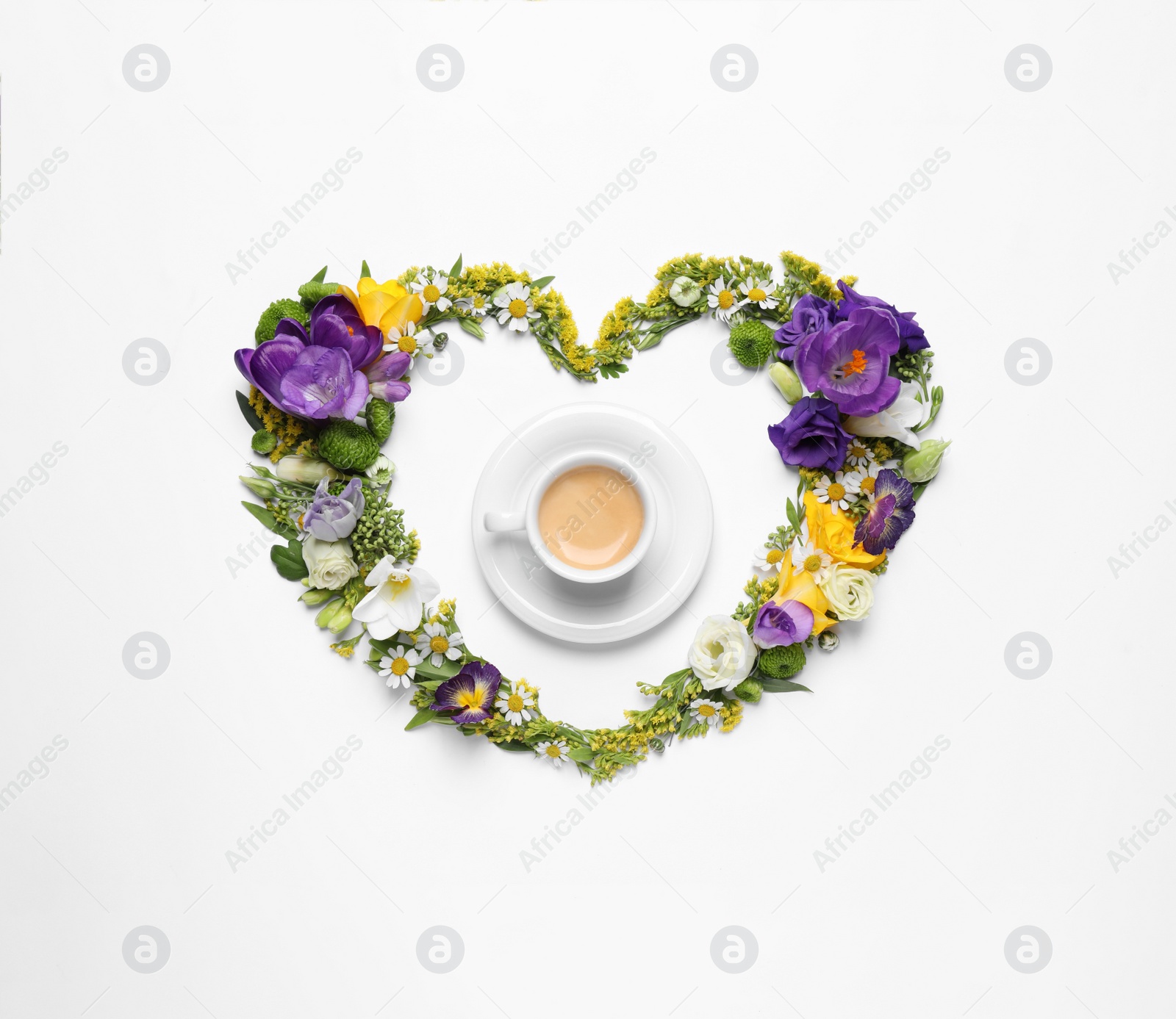 Photo of Beautiful heart made of different flowers and coffee on white background, top view
