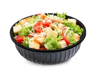 Delicious fresh salad in plastic container on white background 