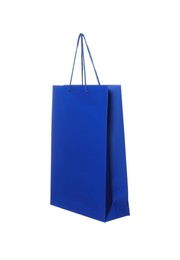 Photo of One blue shopping bag isolated on white