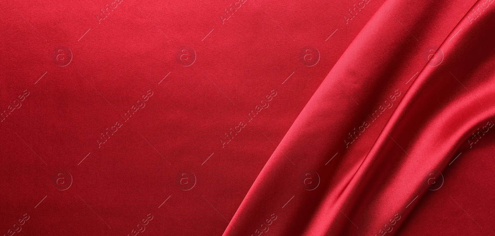 Photo of Texture of beautiful red silk fabric as background, closeup