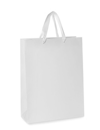 Photo of Paper shopping bag isolated on white. Mock up for design