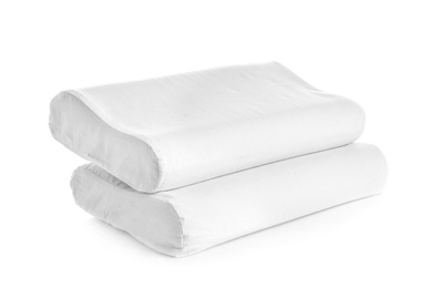 Photo of Clean soft orthopedic pillows on white background