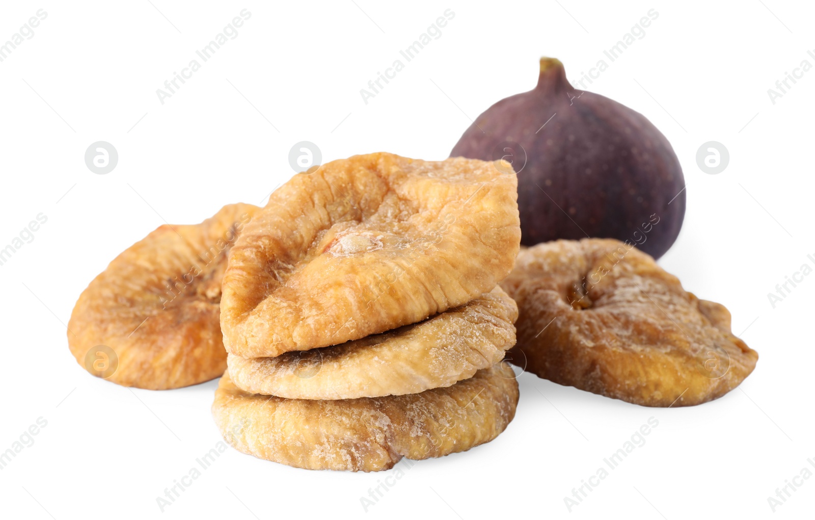 Photo of Tasty dried and raw figs on white background