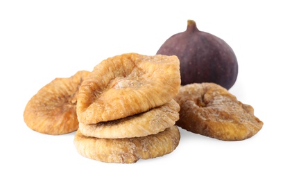 Tasty dried and raw figs on white background