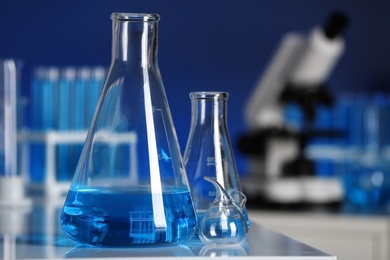 Photo of Laboratory glassware on table indoors. Chemical analysis