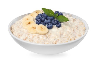 Photo of Tasty boiled oatmeal with banana and blueberries in bowl isolated on white