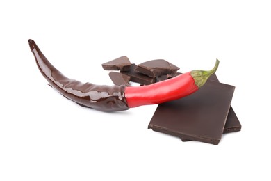 Photo of Red hot chili pepper and dark chocolate isolated on white