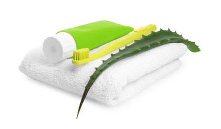 Photo of Tube of toothpaste, brush, aloe vera leaf and towel on white background