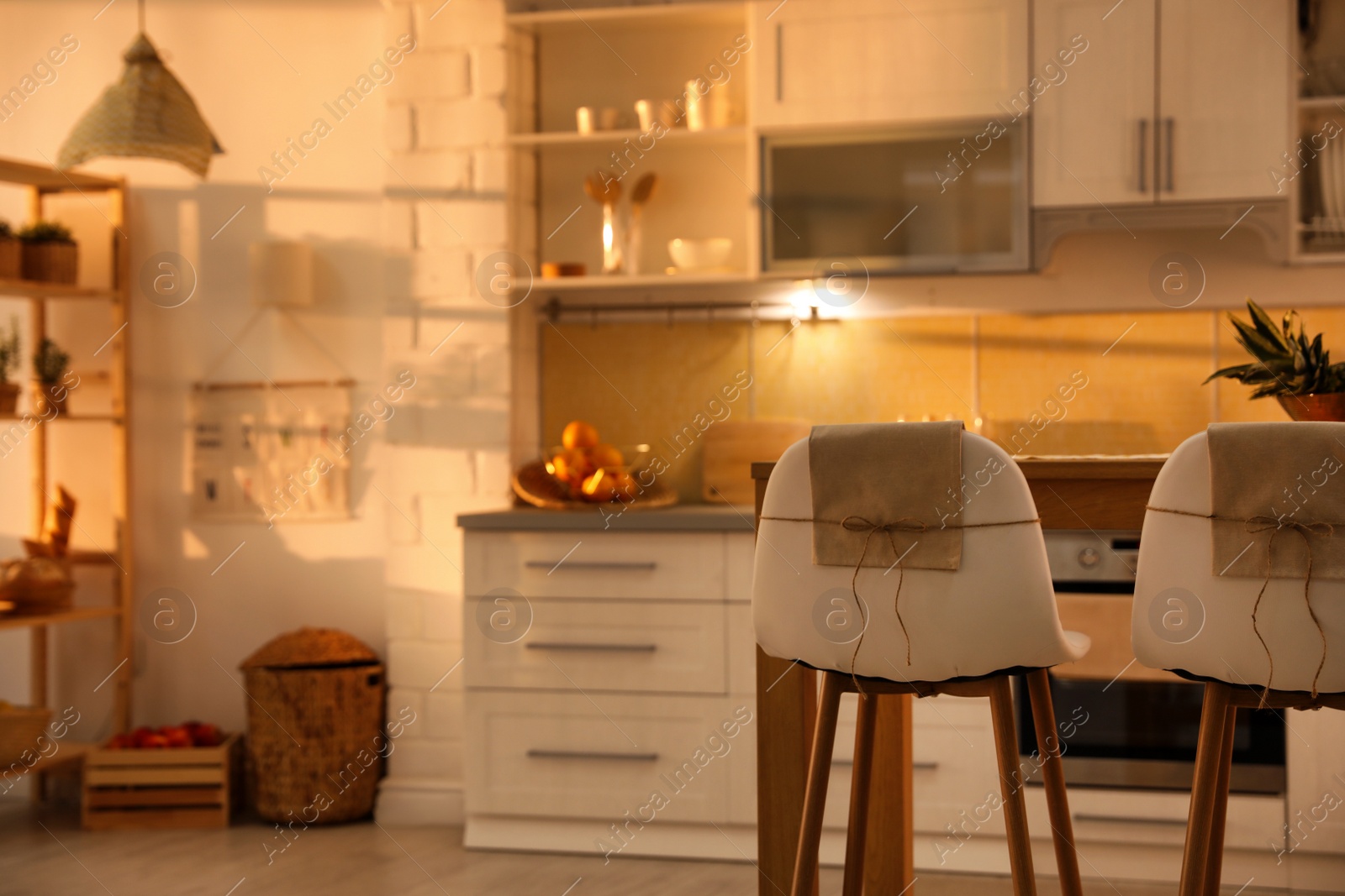 Photo of Modern kitchen interior with stylish wooden table. Space for text