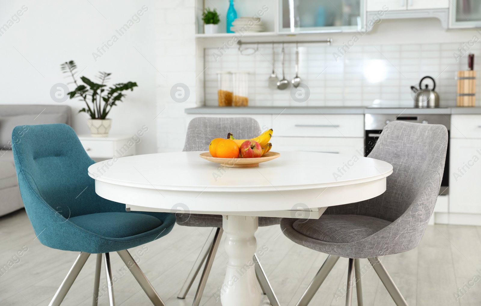 Photo of Stylish room interior with dining table and chairs