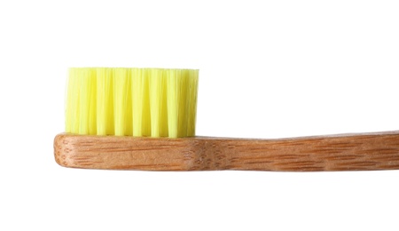 Toothbrush made of bamboo on white background, closeup