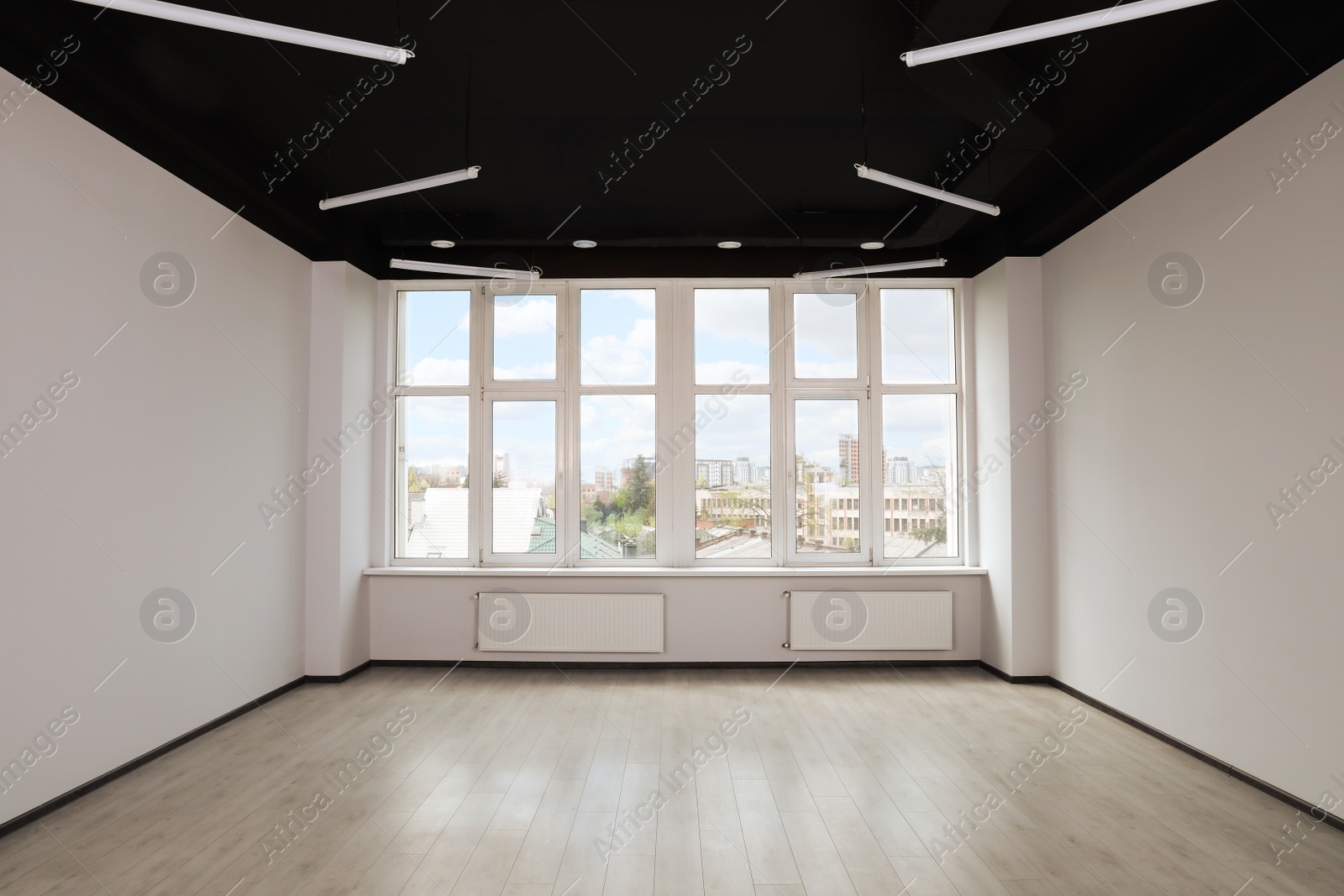 Photo of Modern office with window and radiators. Interior design