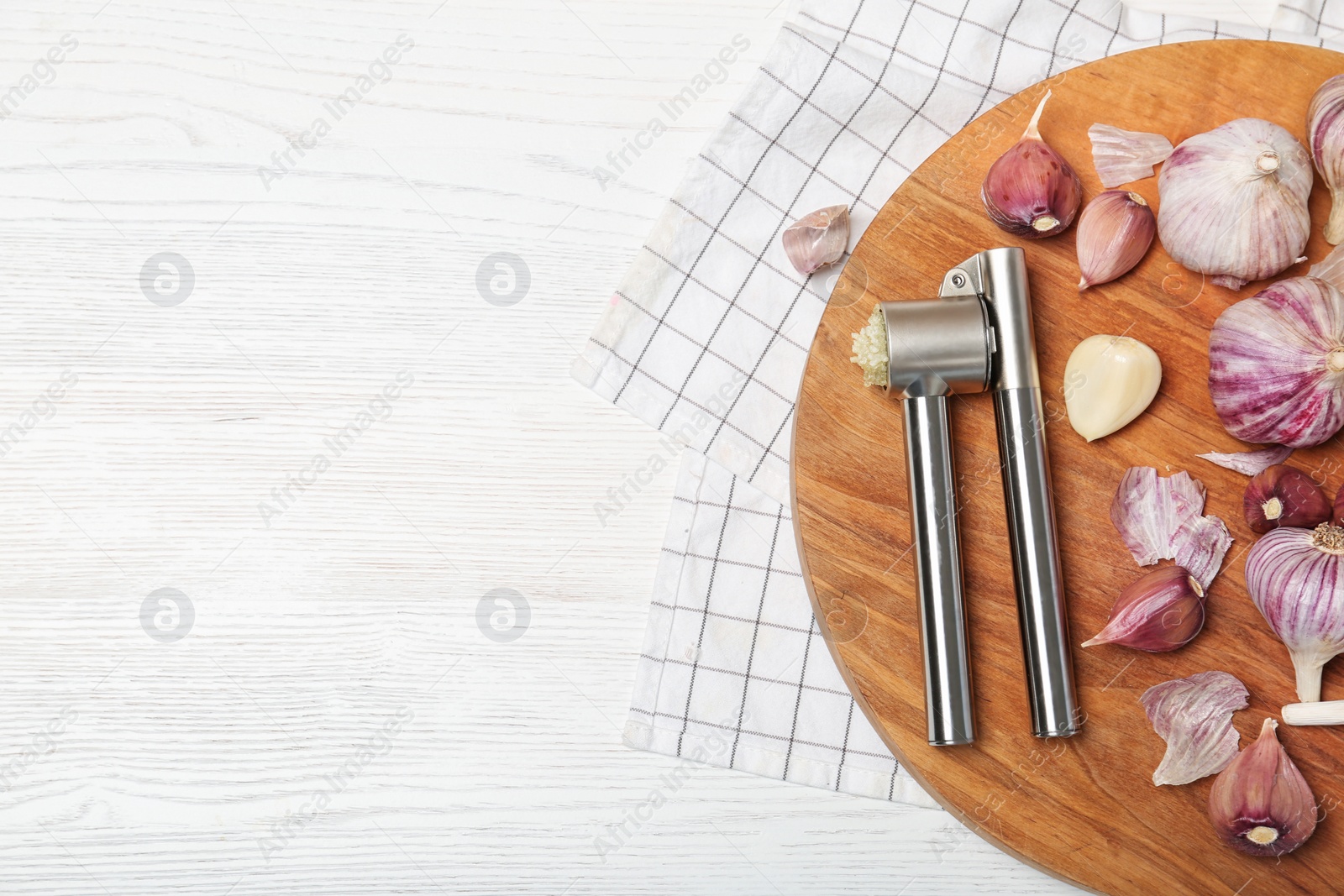 Photo of Flat lay composition with garlic press on wooden table