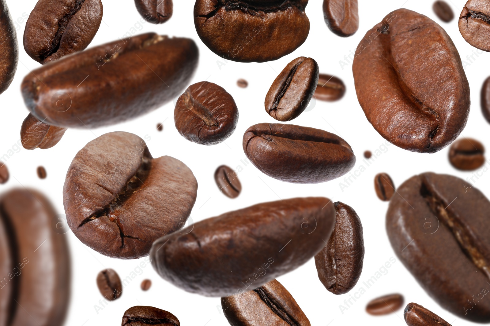 Image of Roasted coffee beans falling o white background