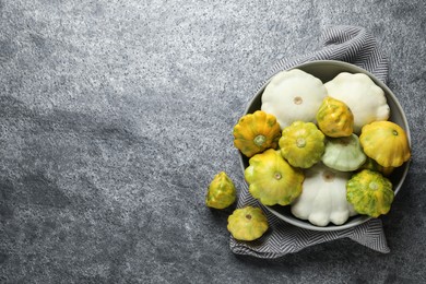 Photo of Fresh ripe pattypan squashes on grey table, flat lay. Space for text