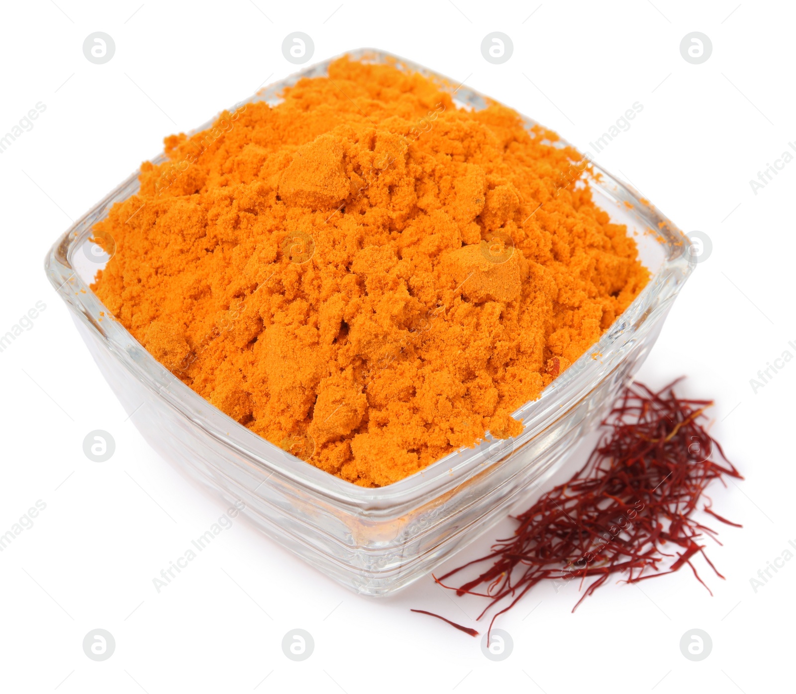 Photo of Bowl with saffron powder and dried flower stigmas on white background