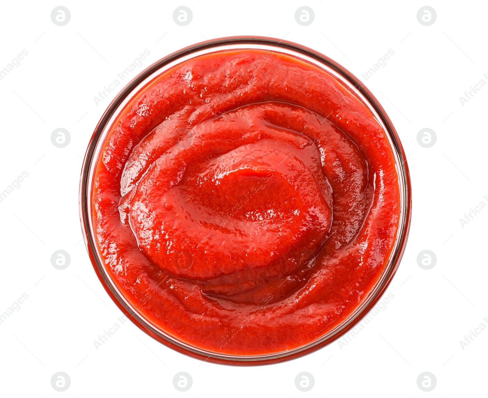 Photo of Tasty ketchup in glass bowl isolated on white, top view