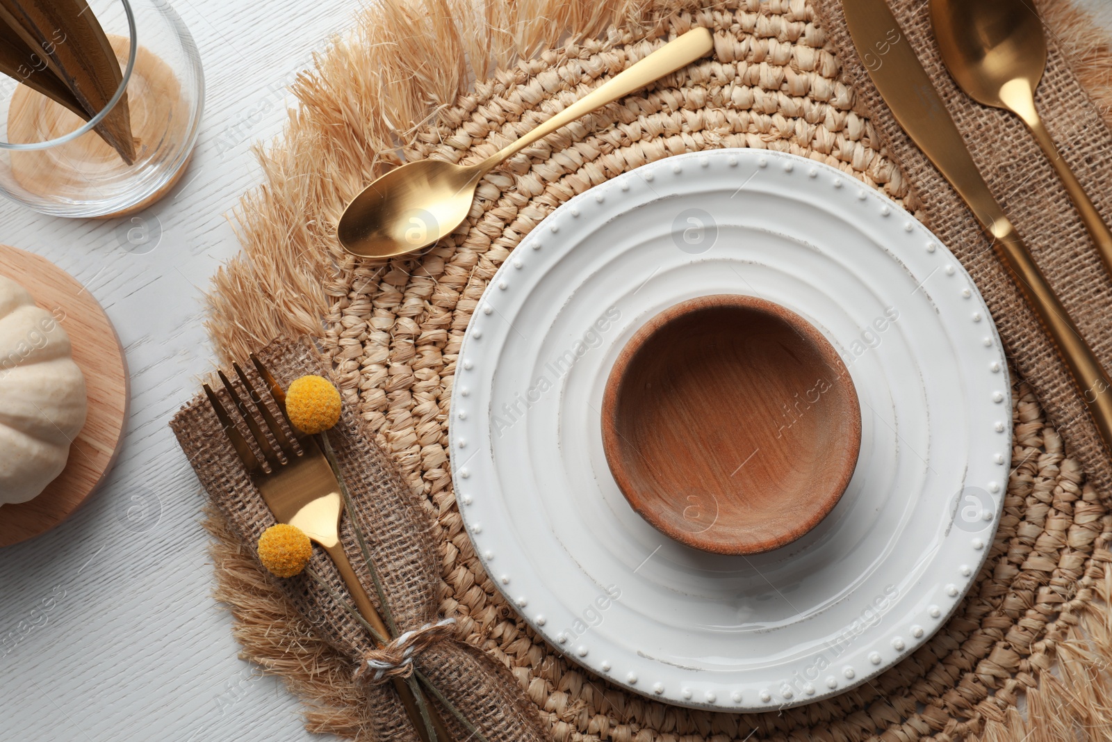 Photo of Autumn table setting on white wooden background, flat lay