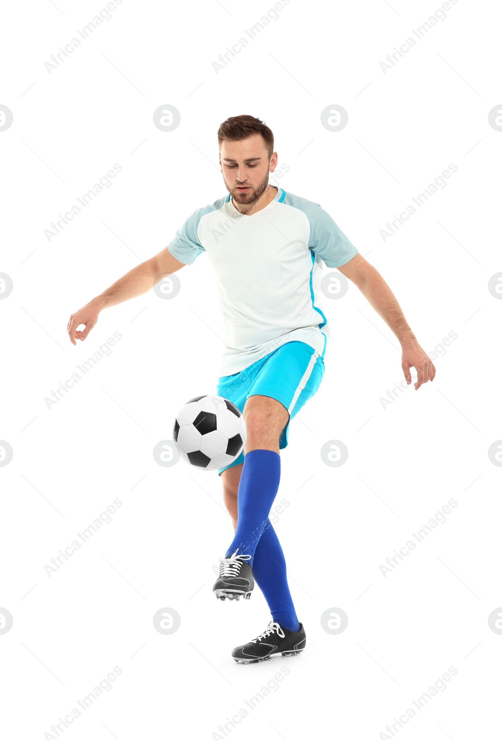 Photo of Young man playing football on white background