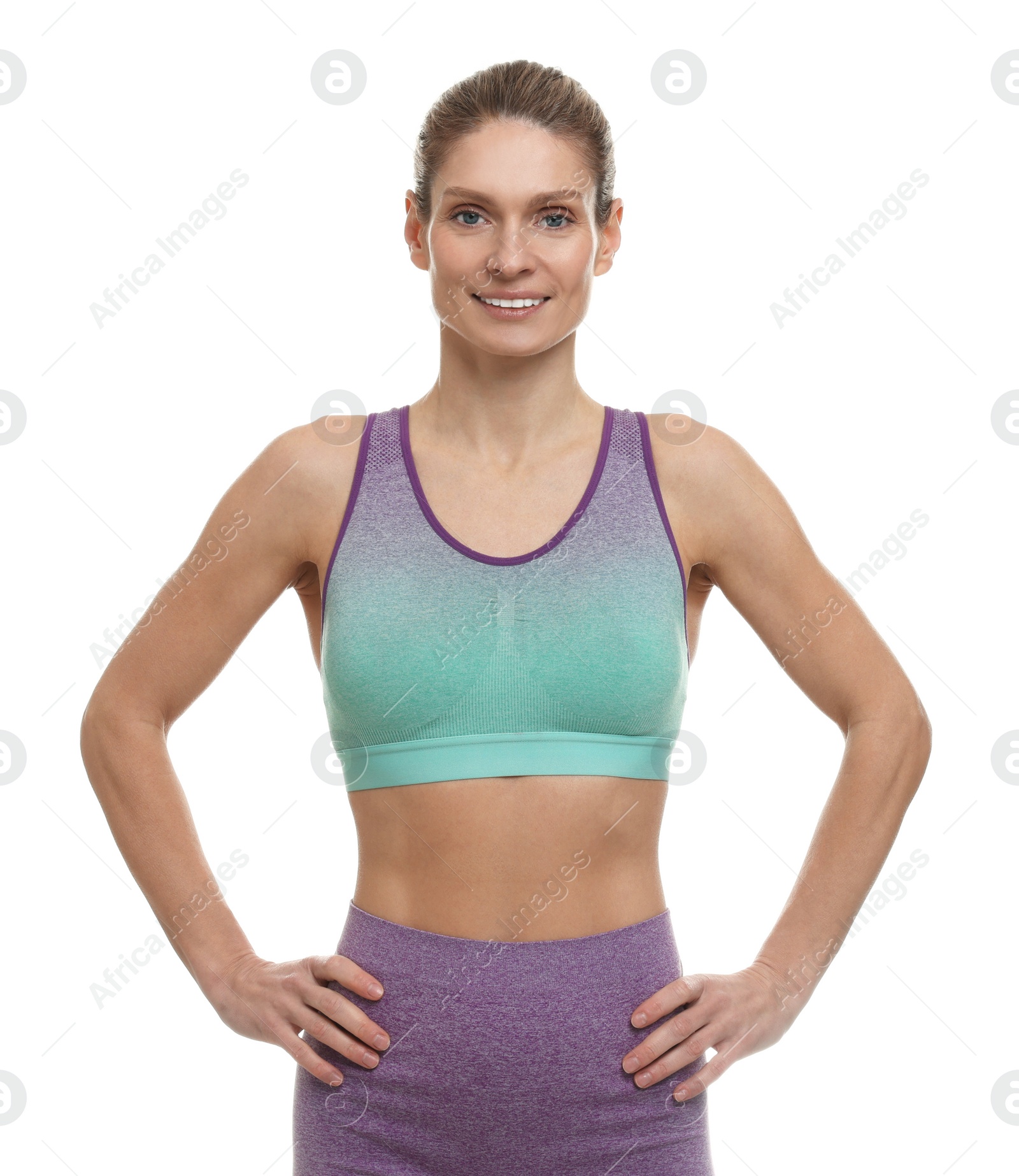 Photo of Portrait of woman in sports wear on white background