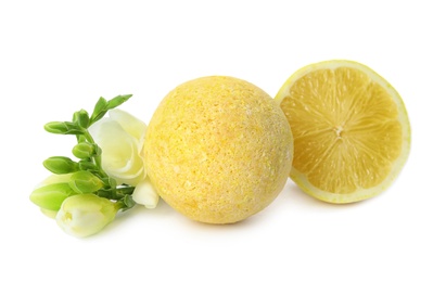 Photo of Bath bomb, flowers and lemon on white background