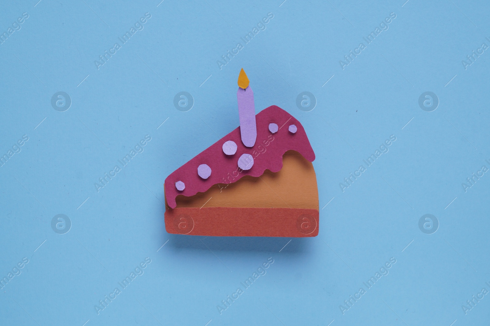 Photo of Birthday party. Paper cake with candle on light blue background, top view