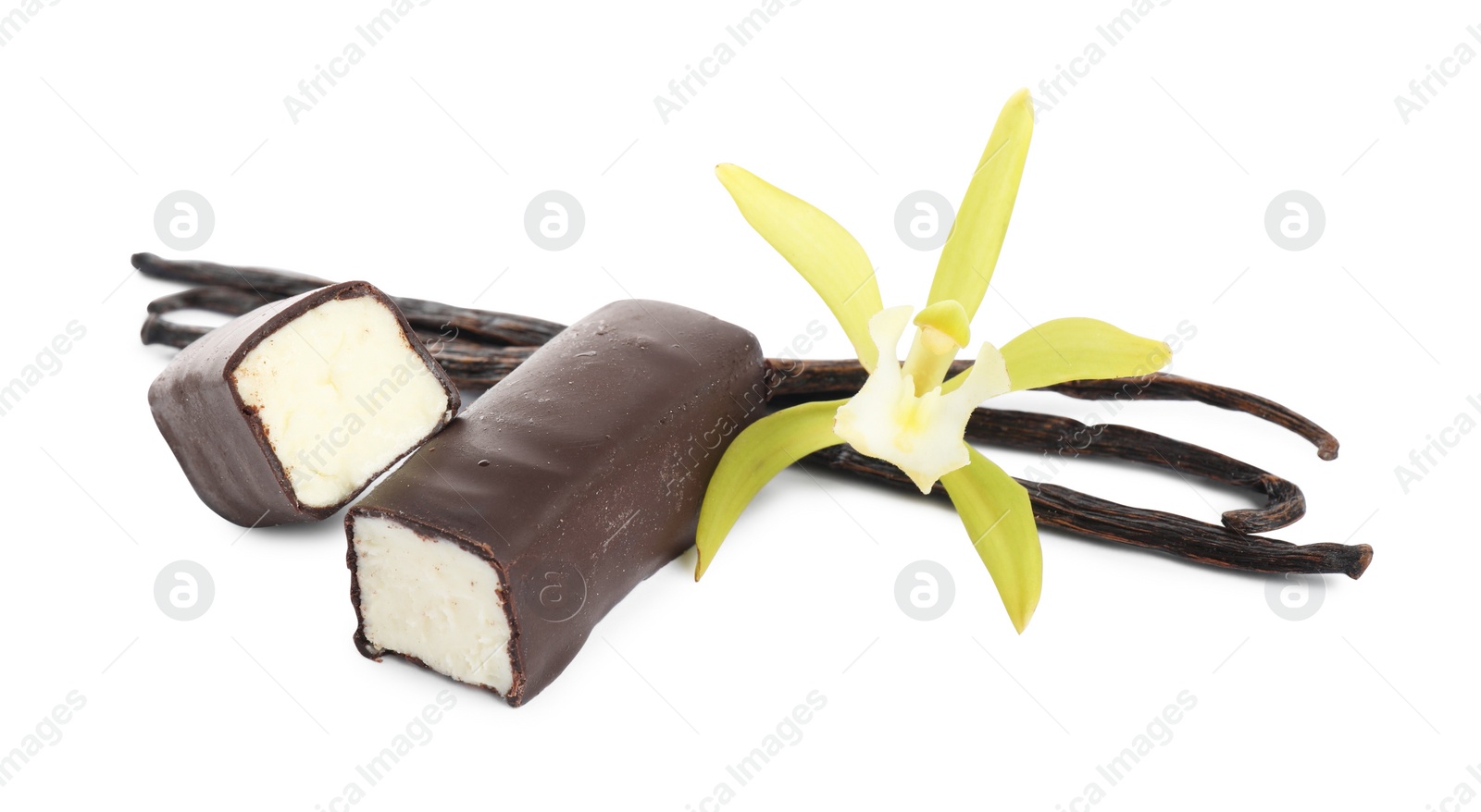 Photo of Glazed curd cheese bars, vanilla pods and flower isolated on white