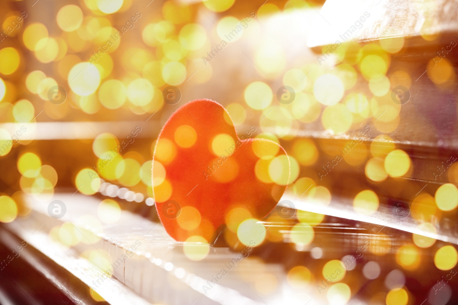 Image of Christmas and New Year music. Piano with heart, bokeh effect