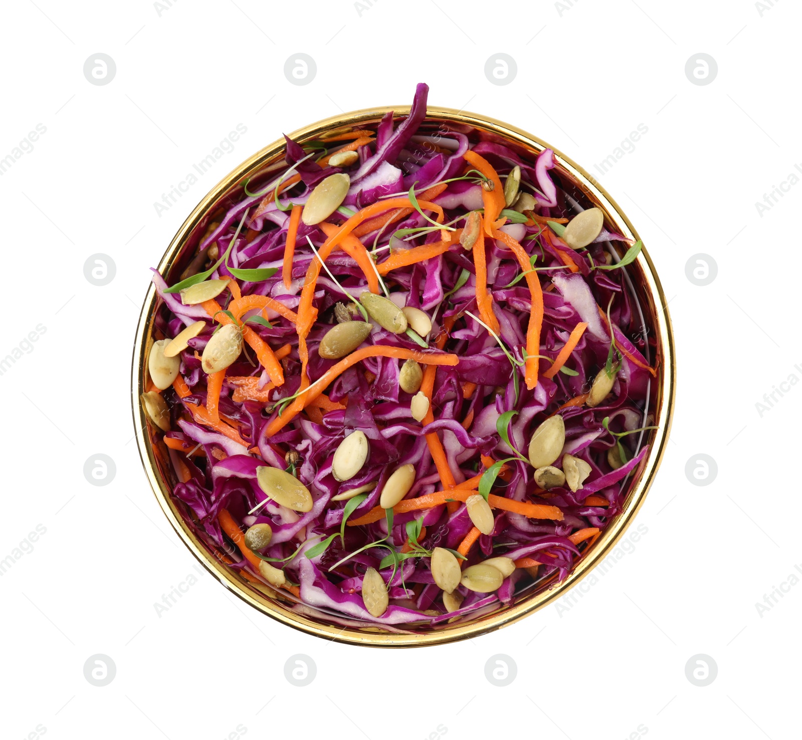 Photo of Tasty salad with red cabbage and pumpkin seeds in bowl isolated on white, top view