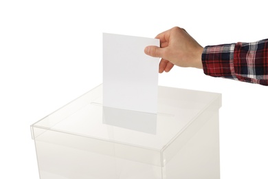 Man putting his vote into ballot box on white background, closeup