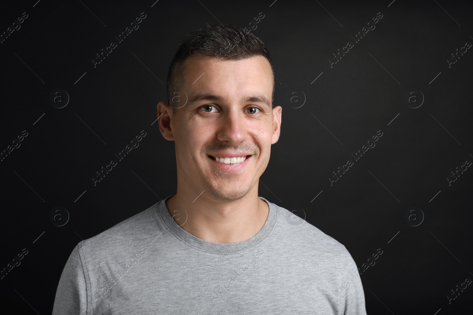 Photo of Portrait of handsome man on black background