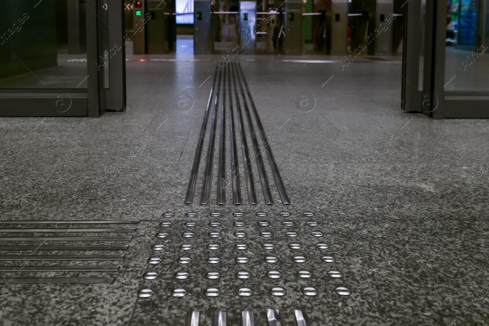 Photo of Floor tiles with tactile ground surface indicators, closeup